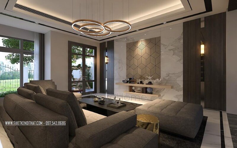 Sắp xếp không gian phòng khách rộng, hiện đại ấn tượng với ý tưởng sử dụng gam màu đối lập từ xám trắng cùng đồ nội thất cao cấp. Thiết kế phòng khách nhà phố