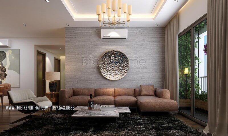 Không gian phòng khách trầm ấm với bộ sofa da chữ L cao cấp kết hợp với thảm lông trải sàn tối màu tạo nên sự tinh tế cho không gian phòng