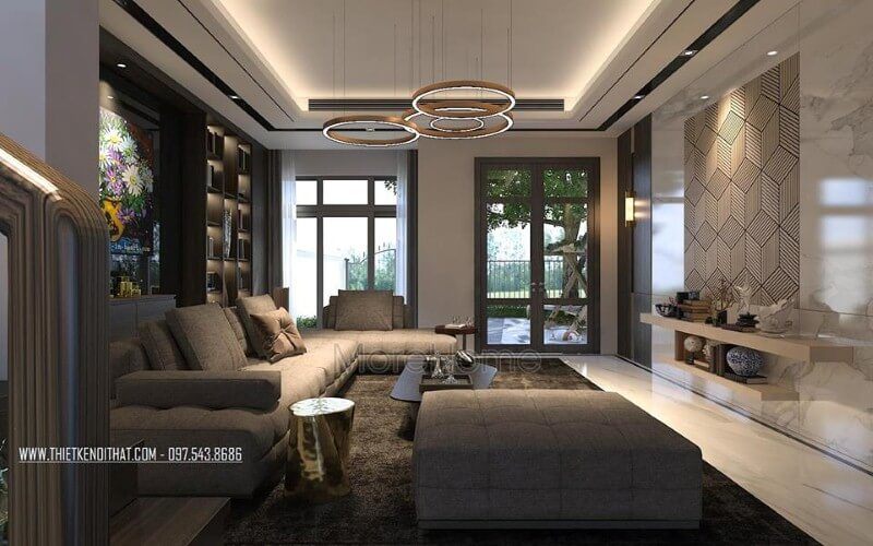 Phòng khách nhà phố đầy ấm cúng với tâm điểm là bộ sofa hiện đại kiểu dáng góc tối ưu diện tích được bọc vải êm ái màu xám tinh tế.