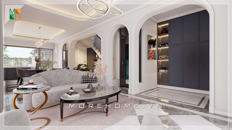 .
Khi bước vào phòng khách này, những đường cong đẹp hút mắt, uốn lượn của sofa, bàn trà, kệ trang trí và đường nét phào chỉ trên tường, trên trần nhà đã làm cho mọi người phải ngạc nhiên với vẻ đẹp cổ điển pha chút hiện đại của không gian này.
